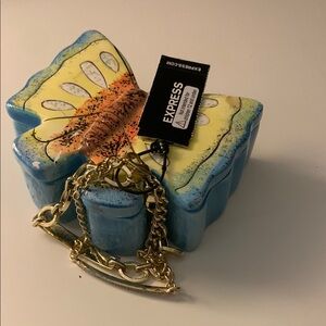 Express yellow with Gold Chain Bracelet.